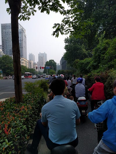 Sights around Nanjing: 1) recreation of Nanjing in the early 1900s. 2) recreation of a traditional tea house. 3) motorbikes dot the city streets