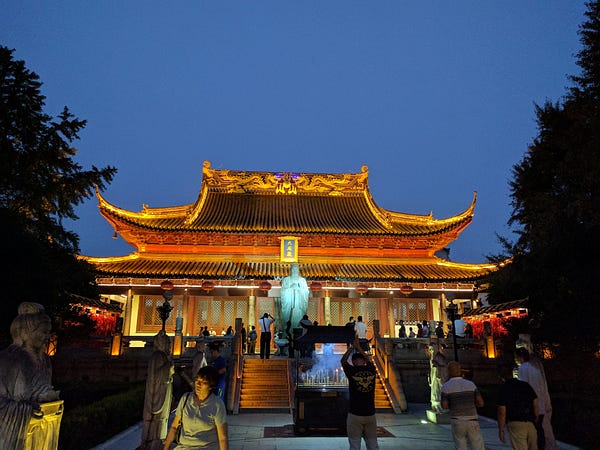 Sights around Nanjing: 1) an eatery. 2) Qinhuai River night scene. 3) Confucious temple